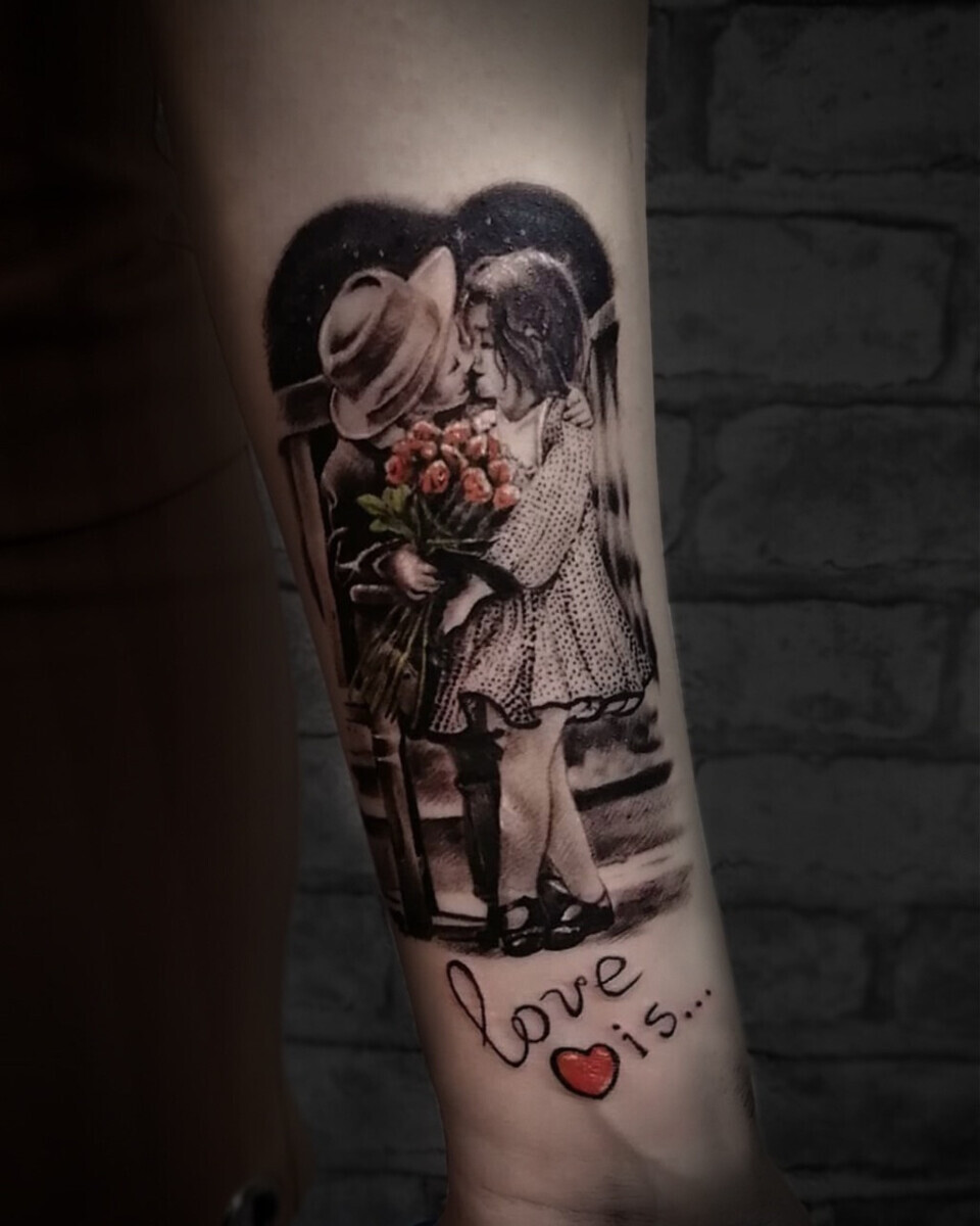 Татуировка Love is... в стиле реализм на предплечье