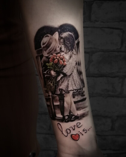 Татуировка Love is... в стиле реализм на предплечье